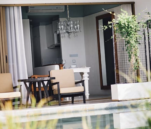 Pool-access suite terrace with lounge chairs right beside the pool