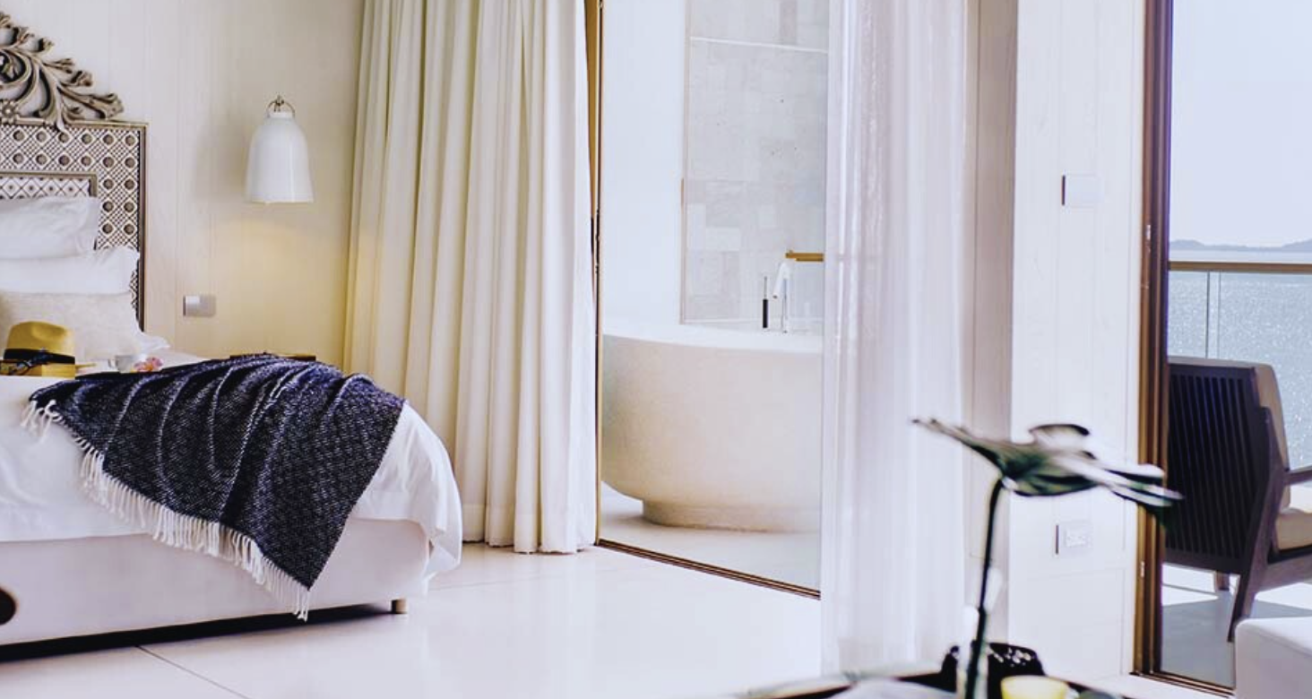 King bed and a terrace soaking bathtub overlooking the sea